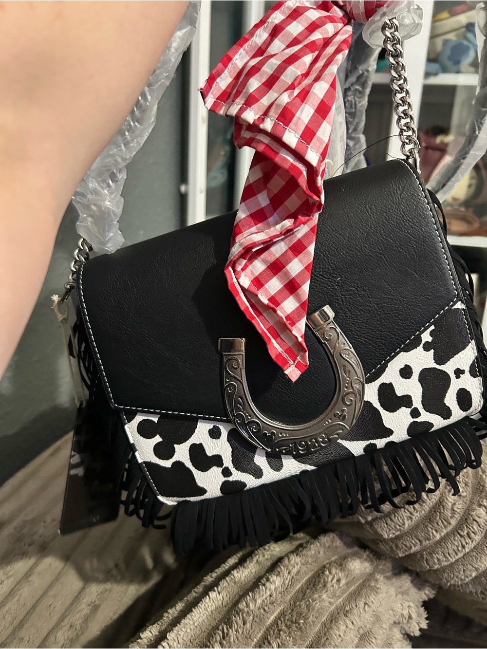 Loungefly Black & White Cow-Print Fringe Shoulder Bag with Red Scarf Accent